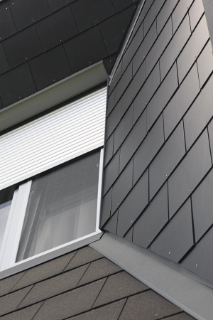 Obklad z desek Cembrit Express chrání jihovýchodní fasádu v 2. NP