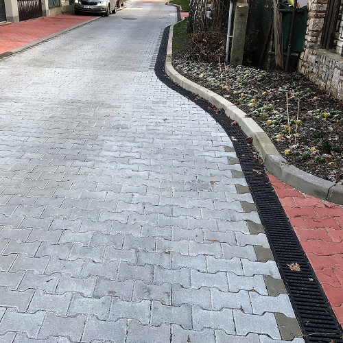 Odvodnění obytných zón bez podélného spádu v Praze 9 žlaby MEA