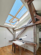 Prosvětlení a ventilace střešních prostor v domě Franze Kafky v Praze