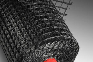 Sklo-vláknitá geomříž bránící vzniku provozních trhlin v silničním asfaltu