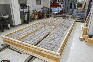 Spriahnuté drevobetónové stropy 4S – vývoj, testovanie a realizácia